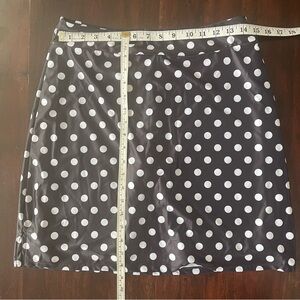 Swim skirt. Black with white polka dots skirt with solid black under shorts.